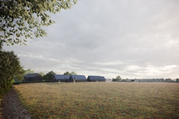 CGI image of four replacement dwellings behind a field in the Essex countryside.